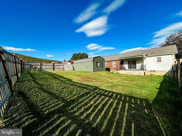 a view of swimming pool with outdoor seating and deck