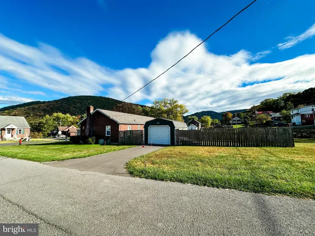 a view of a room with gym equipment and a window