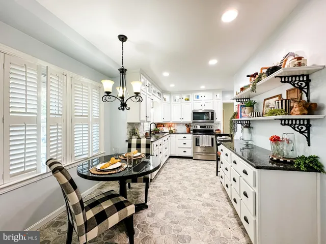 a very nice looking dining room with a table and chairs