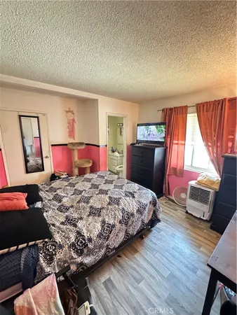 a bedroom with a bed and a fireplace