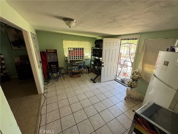 a white refrigerator freezer and a stove sitting inside of a kitchen