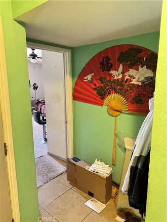 a bedroom with furniture and a gym equipment