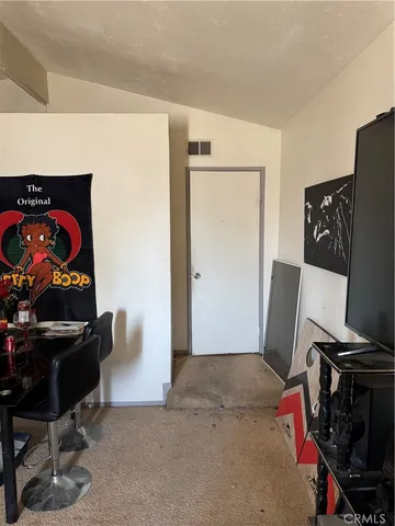 a bedroom with a bed and a closet