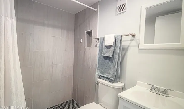 a view of living room with wooden floor