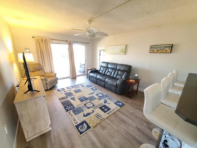 a living room with furniture and a rug