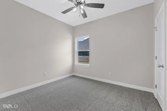 a view of kitchen with wooden floor and electronic appliances