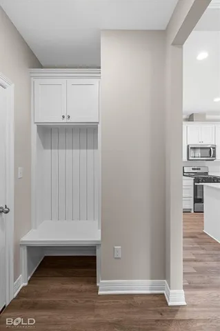 a view of cabinets and wooden floor