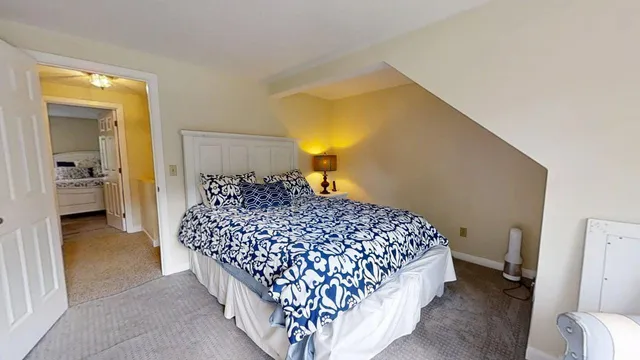 a bedroom with a bed and dresser