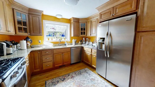 a kitchen with a refrigerator and a sink