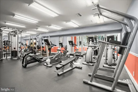 a bedroom with a bed and a chair