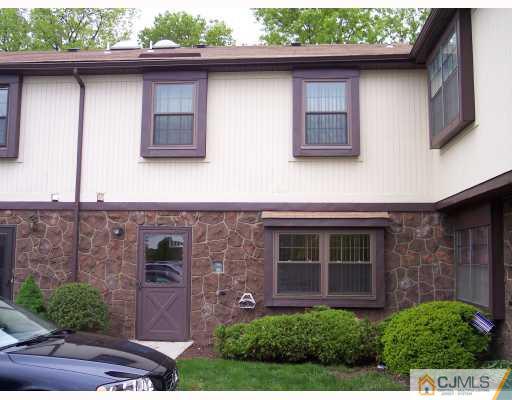 8006 Hana Road Edison, NJ 08817 - Photo 1 of 9 a front view of a house with garden