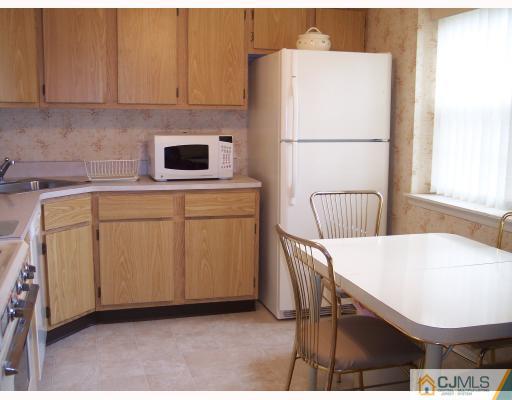 8006 Hana Road Edison, NJ 08817 - Photo 7 of 9 a utility room with dryer and washer