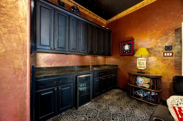 a kitchen with stainless steel appliances granite countertop a stove and a refrigerator