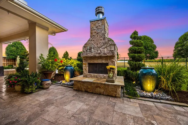 a view of a porch with furniture and a fire pit