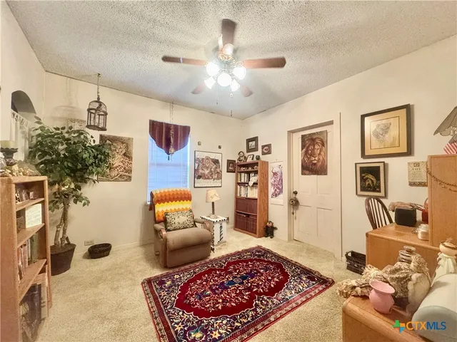 a living room with furniture and a rug