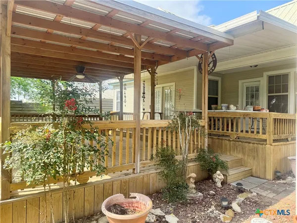 a view of a porch with wooden floor