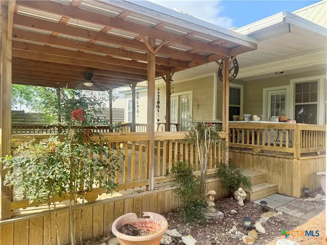 a view of a porch with wooden floor