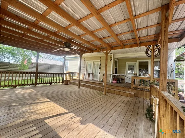 a view of a porch with wooden floor