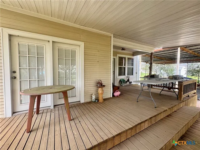 a view of a swimming pool with a porch