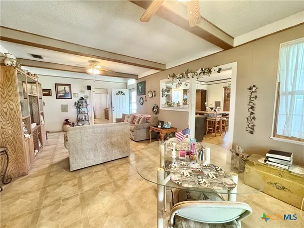 a living room with furniture and a table