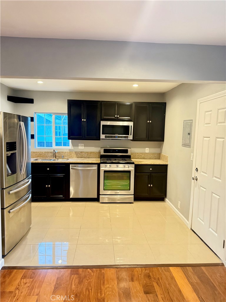 5010 3rd Avenue Los Angeles, CA 90043 - Photo 1 of 13 a kitchen with stainless steel appliances a refrigerator and a stove top oven