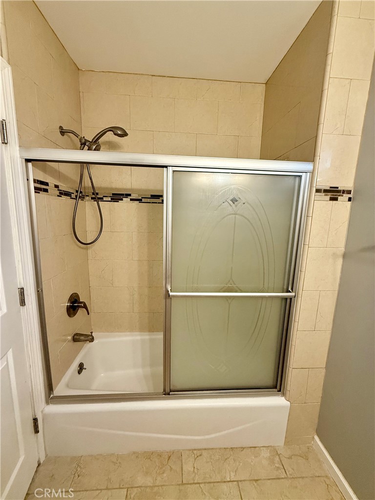 5010 3rd Avenue Los Angeles, CA 90043 - Photo 12 of 13 a bathroom with a shower and a bathtub