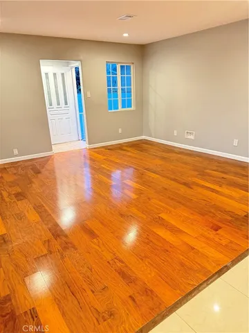 a view of a livingroom with furniture and flat screen tv