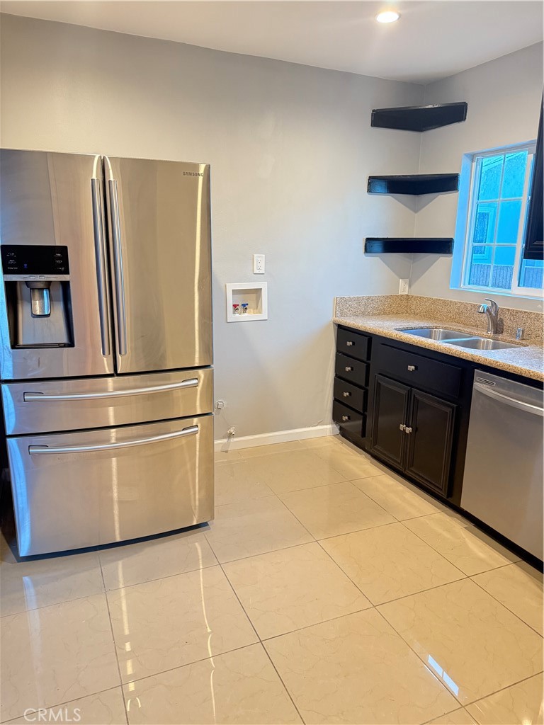 5010 3rd Avenue Los Angeles, CA 90043 - Photo 5 of 13 a kitchen with stainless steel appliances granite countertop a refrigerator and a sink