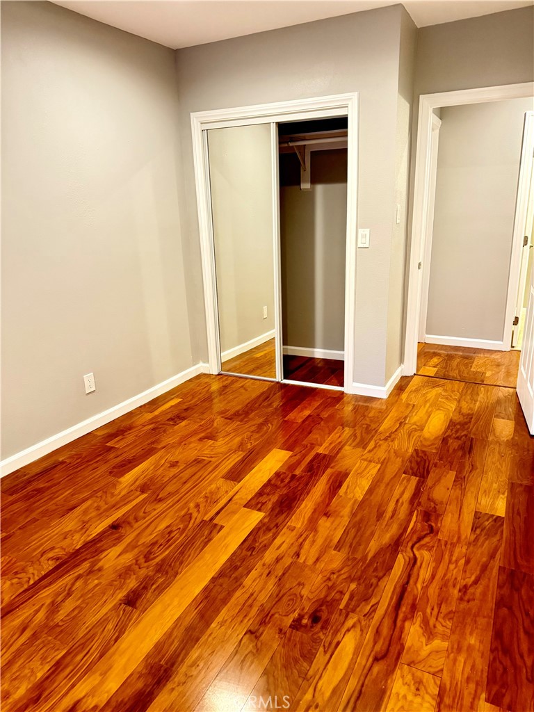 5010 3rd Avenue Los Angeles, CA 90043 - Photo 9 of 13 a view of an empty room with wooden floor