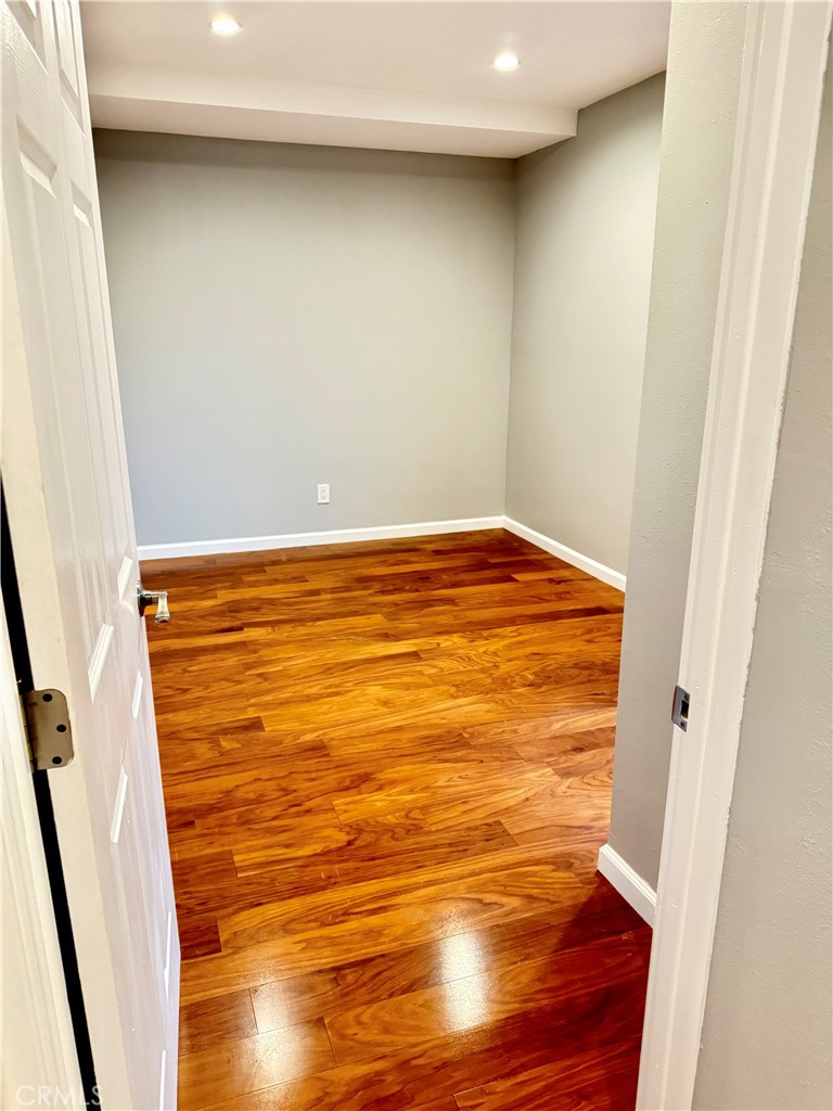 5010 3rd Avenue Los Angeles, CA 90043 - Photo 10 of 13 a view of empty room with wooden floor and door