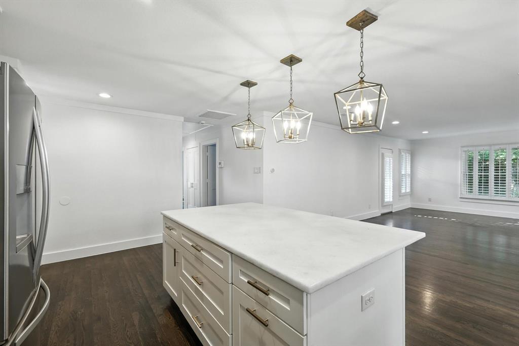 6116 St Moritz Avenue Dallas, TX 75214 - Photo 11 of 40 a view of a kitchen island in the kitchen