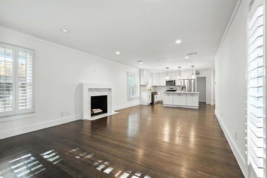 6116 St Moritz Avenue Dallas, TX 75214 - Photo 12 of 40 a view of kitchen and hall with wooden floor