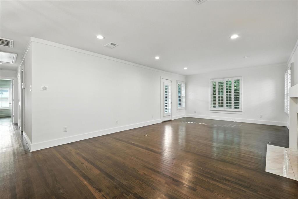 6116 St Moritz Avenue Dallas, TX 75214 - Photo 15 of 40 a view of empty room with wooden floor and fan