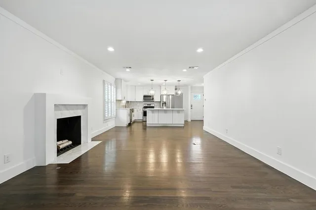 a view of kitchen with furniture and fireplace