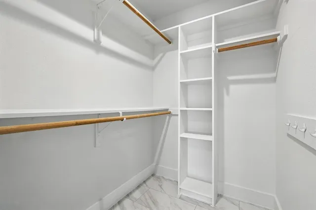 a view of an empty walk in closet