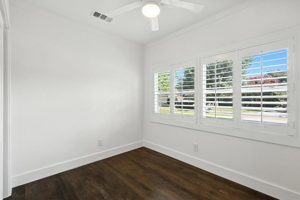 6116 St Moritz Avenue Dallas, TX 75214 - Photo 25 of 40 an empty room with wooden floor and windows