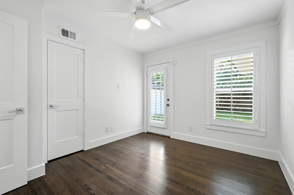 6116 St Moritz Avenue Dallas, TX 75214 - Photo 29 of 40 a view of an empty room with wooden floor and a window