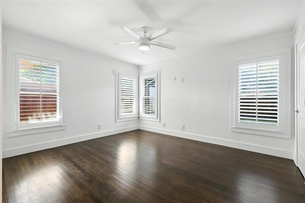 6116 St Moritz Avenue Dallas, TX 75214 - Photo 30 of 40 a view of an empty room with wooden floor and a window