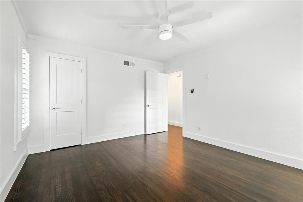 6116 St Moritz Avenue Dallas, TX 75214 - Photo 31 of 40 an empty room with wooden floor and windows