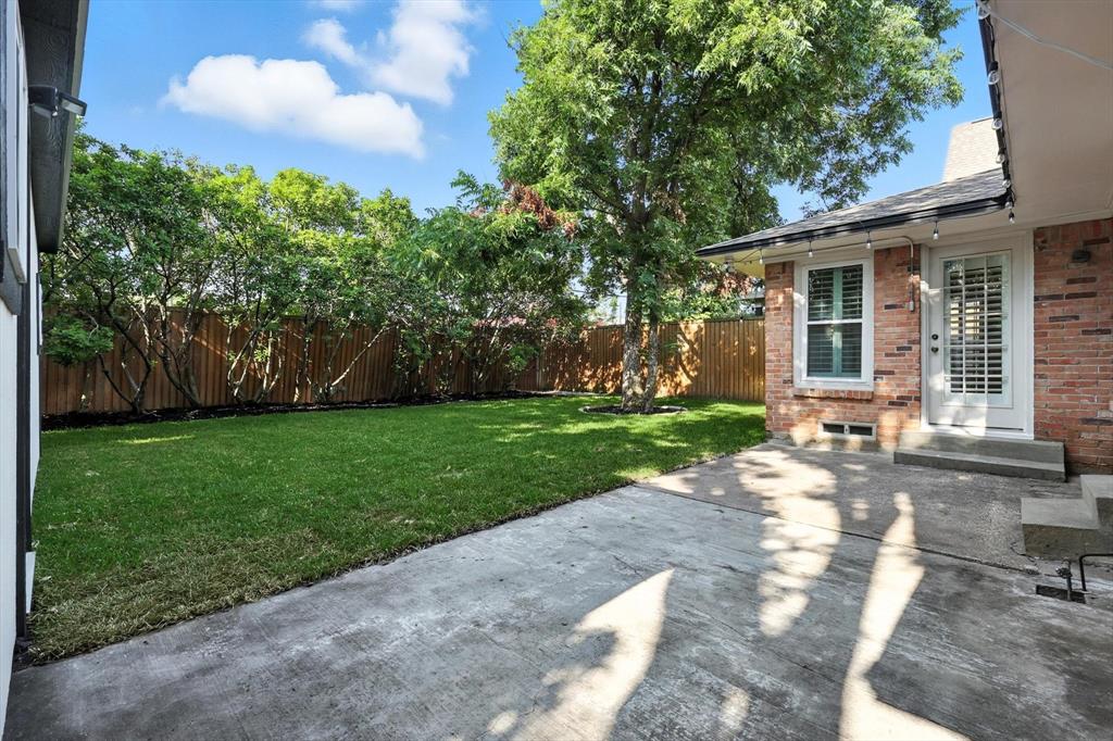6116 St Moritz Avenue Dallas, TX 75214 - Photo 33 of 40 a view of a house with a yard