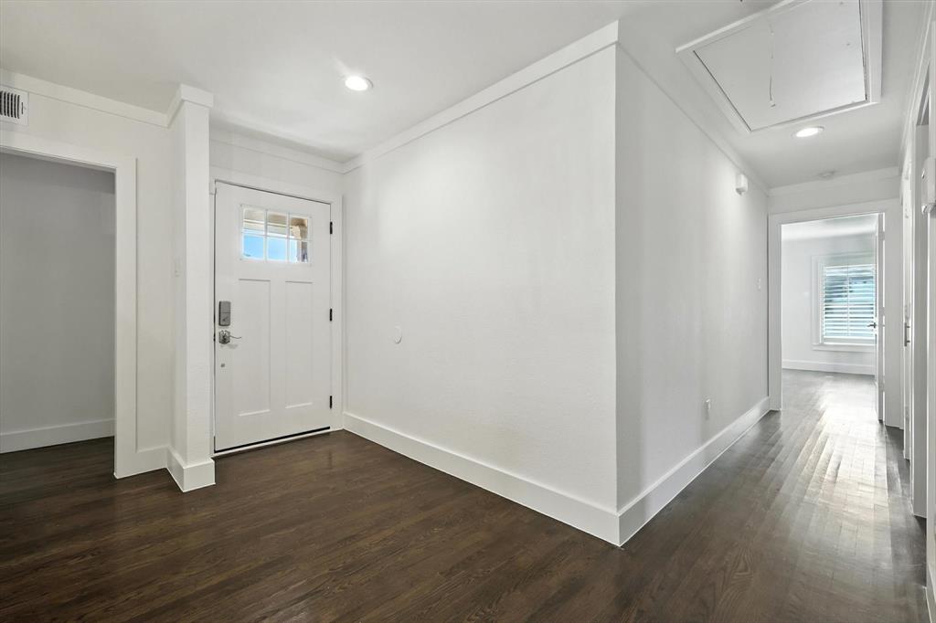 6116 St Moritz Avenue Dallas, TX 75214 - Photo 5 of 40 a view of a hallway with wooden floor