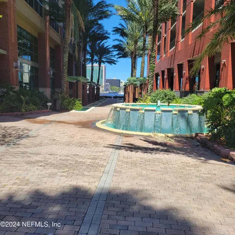 a view of balcony with wooden floor and plants