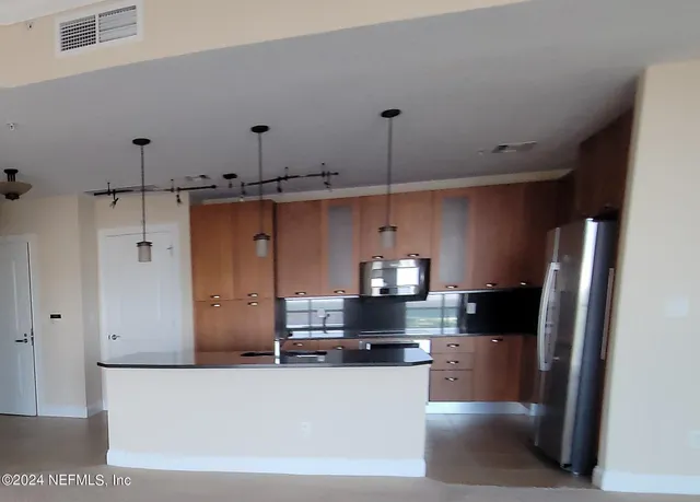 a view of a living room and bathroom