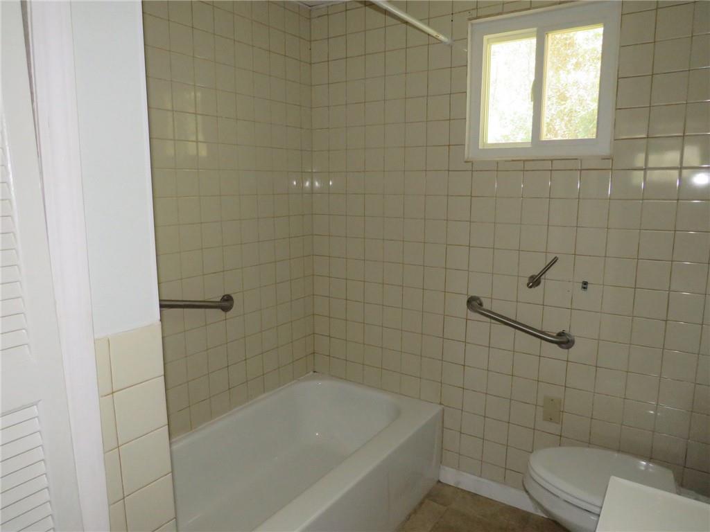 21 Daisytown Road Brownsville, PA 15417 - Photo 12 of 31 a bathroom with a bathtub and toilet