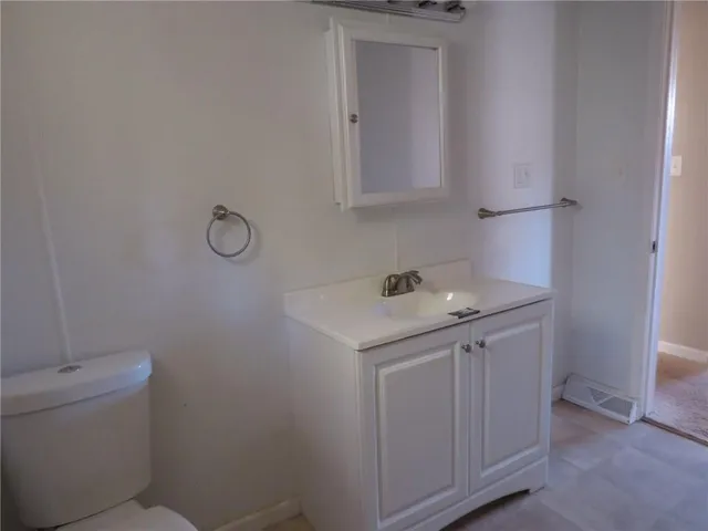 a utility room with cabinets washer and dryer