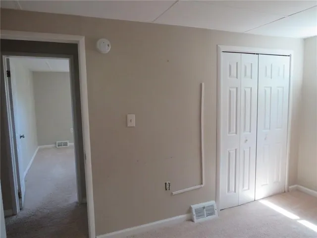 a view of a livingroom with wooden floor