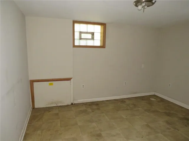 an empty room with a bench