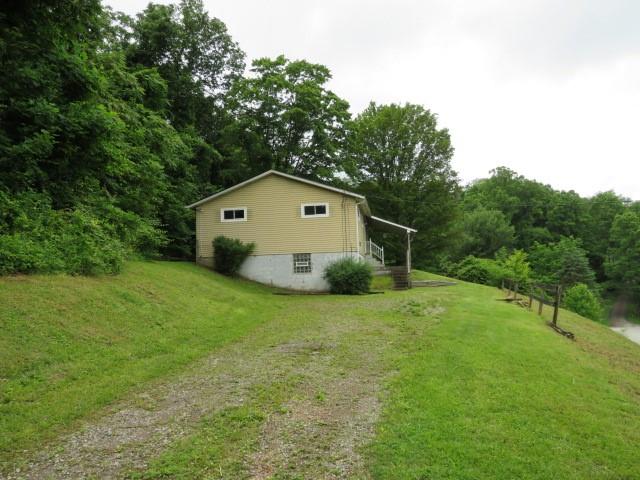 21 Daisytown Road Brownsville, PA 15417 - Photo 30 of 31 a front view of a house with a yard