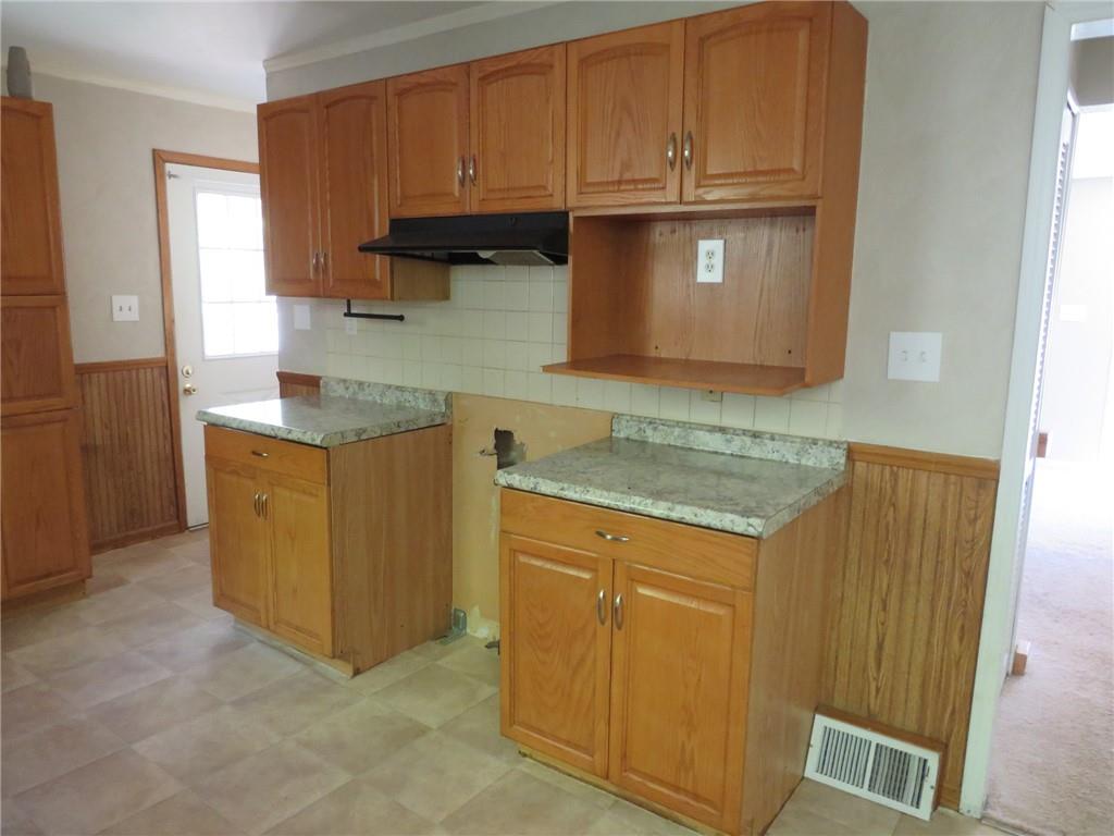 21 Daisytown Road Brownsville, PA 15417 - Photo 5 of 31 a kitchen with granite countertop cabinets and window