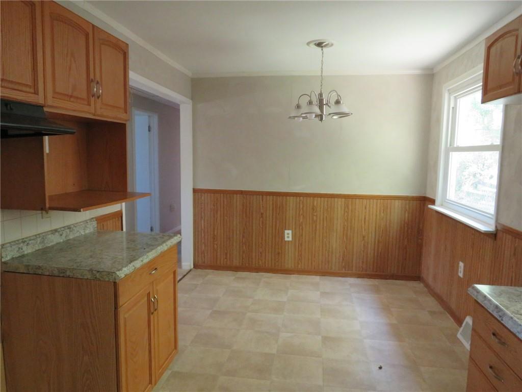 21 Daisytown Road Brownsville, PA 15417 - Photo 7 of 31 a kitchen with granite countertop a sink and a stove